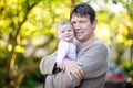 Happy proud young father with newborn baby daughter, family portrait togehter Royalty Free Stock Photo
