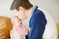 Happy proud young father with newborn baby daughter, family portrait togehter Royalty Free Stock Photo