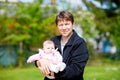 Happy proud young father with newborn baby daughter, family portrait togehter Royalty Free Stock Photo