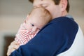 Happy proud young father with newborn baby daughter, family portrait togehter Royalty Free Stock Photo