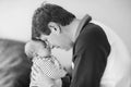 Happy proud young father with newborn baby daughter, family portrait togehter Royalty Free Stock Photo