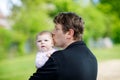 Happy proud young father with newborn baby daughter, family portrait togehter Royalty Free Stock Photo