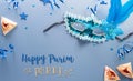 Happy Purim carnival decoration concept made from mask and sparkle star and hamantaschen cookies on pastel background. (Happy