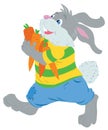 Happy rabbit with an large carrot