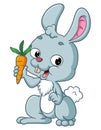 The happy rabbit is showing the small carrot