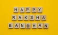 Happy Raksha Bandhan, a minimalistic banner with an inscription in wooden letters Royalty Free Stock Photo