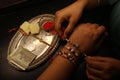 Happy Raksha Bandhan a sister tying rakhi thread on brother`s hand with rakhi decorative thali