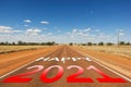 Happy 2021 read and white gradient text on empty road Royalty Free Stock Photo