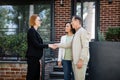 happy realtor in glasses shaking hands Royalty Free Stock Photo