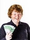 Happy red-haired boy with money Royalty Free Stock Photo