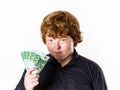Happy red-haired boy with money Royalty Free Stock Photo