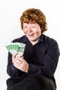 Happy red-haired boy with money Royalty Free Stock Photo