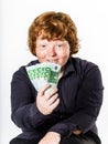 Happy red-haired boy with money Royalty Free Stock Photo