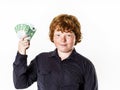 Happy red-haired boy with money Royalty Free Stock Photo
