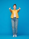 Happy red haired teenage girl showing thumbs up Royalty Free Stock Photo