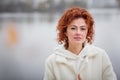 Happy redhair woman in white clothes