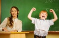 Happy redhead boy in school