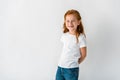 happy redhead child smiling on white.