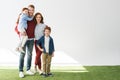 happy redhead family with two kids standing together and smiling at camera Royalty Free Stock Photo