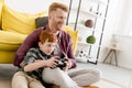 happy redhead father and son playing with joysticks together Royalty Free Stock Photo