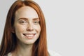 Happy redhead girl smiling looking at camera Royalty Free Stock Photo