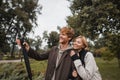 happy redhead man holding umbrella while Royalty Free Stock Photo