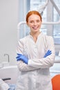 Happy Redhead professional Dentist Orthodontist Posing At Camera At Work Place Royalty Free Stock Photo