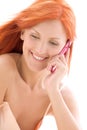 Happy redhead woman with cell phone Royalty Free Stock Photo