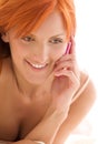 Happy redhead woman with cell phone Royalty Free Stock Photo