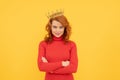 happy redhead woman in crown. self confident queen. expressing smug. arrogant princess