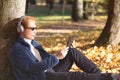 Happy and relax time of Young man with headphone and listening a music of smart phone Royalty Free Stock Photo