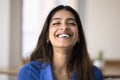 Happy relaxed carefree Indian woman laughing with closed eyes Royalty Free Stock Photo