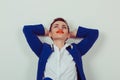 Happy and relaxed. Happy young business woman blue suit looking upwards, hands raised in air relaxing isolated white light green Royalty Free Stock Photo