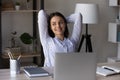 Happy relaxed millennial business woman resting at workplace Royalty Free Stock Photo