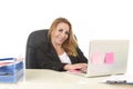 Happy relaxed 40s businesswoman smiling confident working at lap Royalty Free Stock Photo