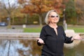 Happy relaxed senior woman celebrating the fall Royalty Free Stock Photo