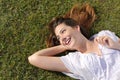 Happy relaxed woman lying on the grass Royalty Free Stock Photo