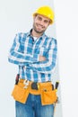 Happy repairman standing arms crossed