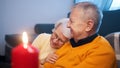 Happy retired couple enjoying valentines day with candle lights. Love romance and dating at old age Royalty Free Stock Photo