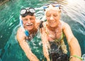 Happy retired couple taking selfie in tropical sea excursion Royalty Free Stock Photo