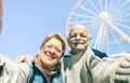 Happy retired senior couple taking selfie at winter travel trip