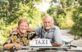 Happy retired senior couple taking travel photo at scooter taxi tour Royalty Free Stock Photo