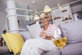 Retired senior woman relaxing at home, using digital tablet Royalty Free Stock Photo