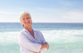 Happy retired woman on the beach