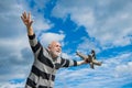 happy retirement. mature granddad with toy. retired old man outdoor. senior man at retirement