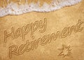 Happy Retirement message handwritten on smooth sand beach with gentle wave