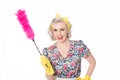 Happy retro housewife, with feather duster, isolated on white