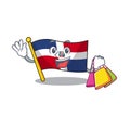 A happy rich flag dominican republic waving and holding Shopping bag Royalty Free Stock Photo