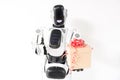 Happy robot is standing with gift box Royalty Free Stock Photo