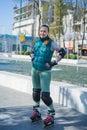 Happy Roller Girl skating in the park